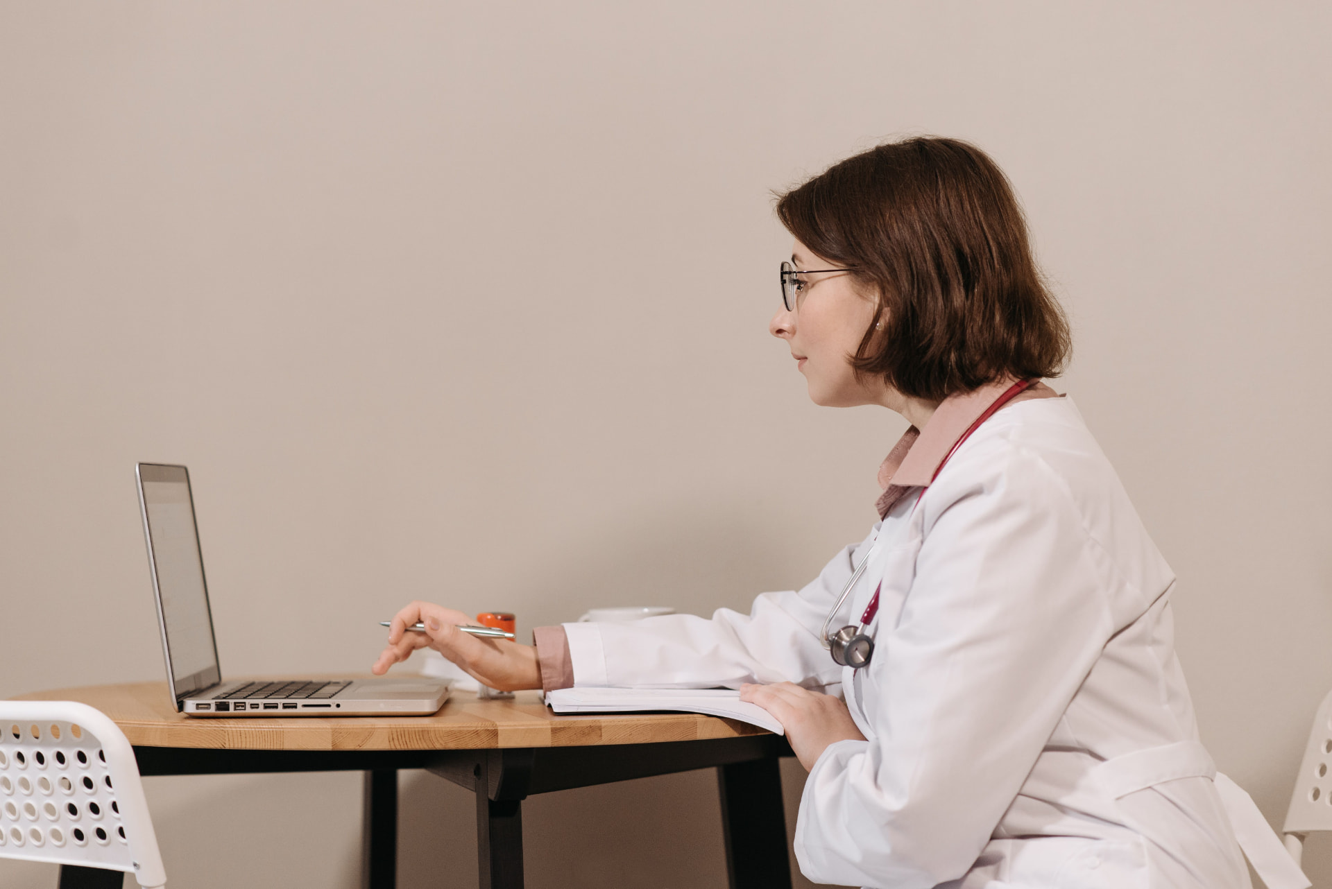 Clinician reviewing clinical trial information on a laptop